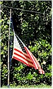 A USA flag at half staff on Memorial Day, 2023